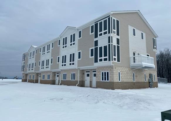 A picture containing snow, sky, outdoor, building
Description automatically generated